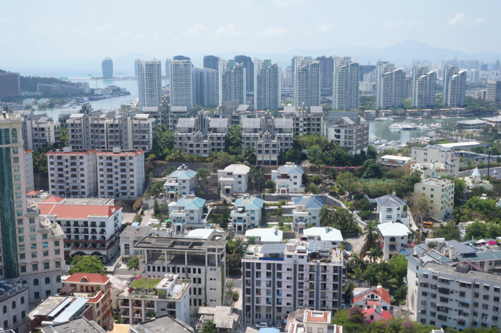 Top floor view from the Barry Boutique Hotel. One of the skyscrapers on the artificial Phoenix island can be seen on the left side in a distance. Sanya, Hainan Island, China