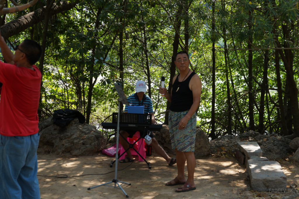 Amateur musicians prepare to perform in a park in Sanya, Hainan Island, China