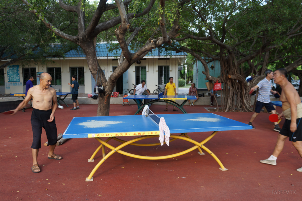 Residents play ping-pong in a park in Sanya, Hainan Island, China